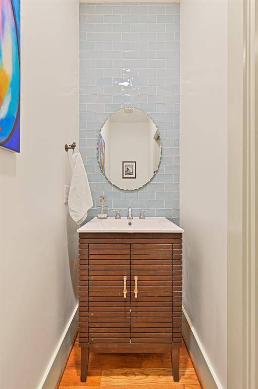 1/2 bath located in hallway across from guest bedroom