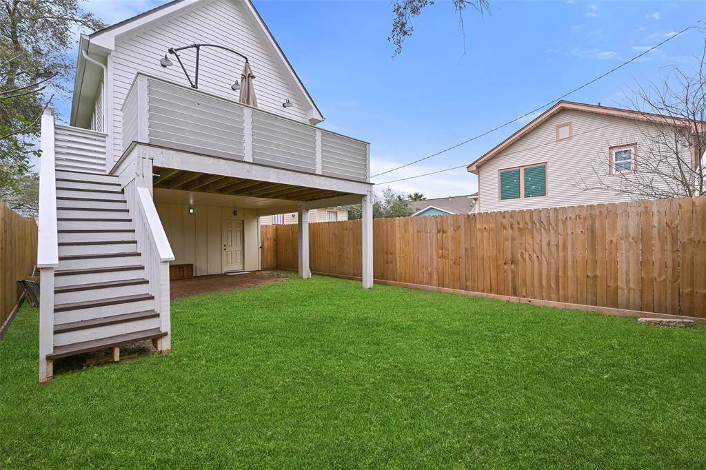 Roomy backyard with alley access, fully fenced.