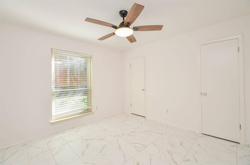 Closet in smaller bedroom behind doors