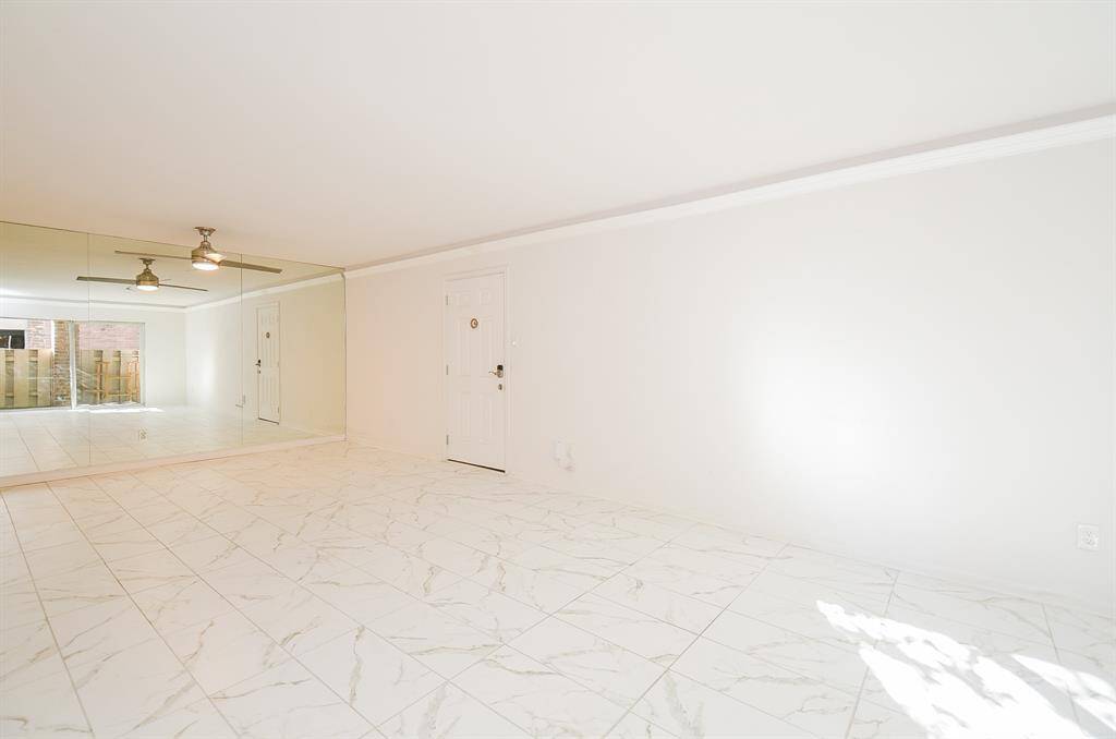 Ceramic tile is white with subtle black grain lines grout is white