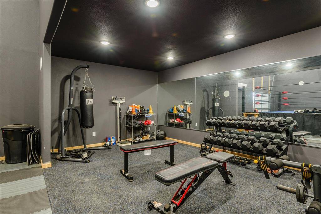keep this large, air-conditioned space as a gym, or convert to a workshop/garage