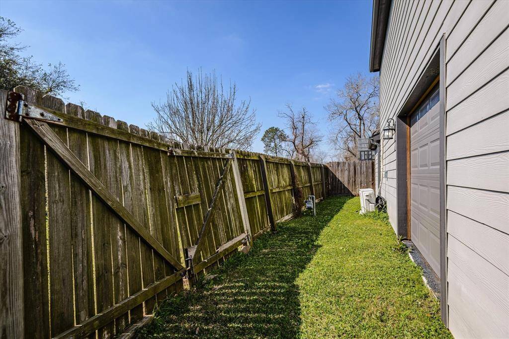 The back building has easy access form the alley.  The wide overhead door allows for vehicles or larger item to be stored