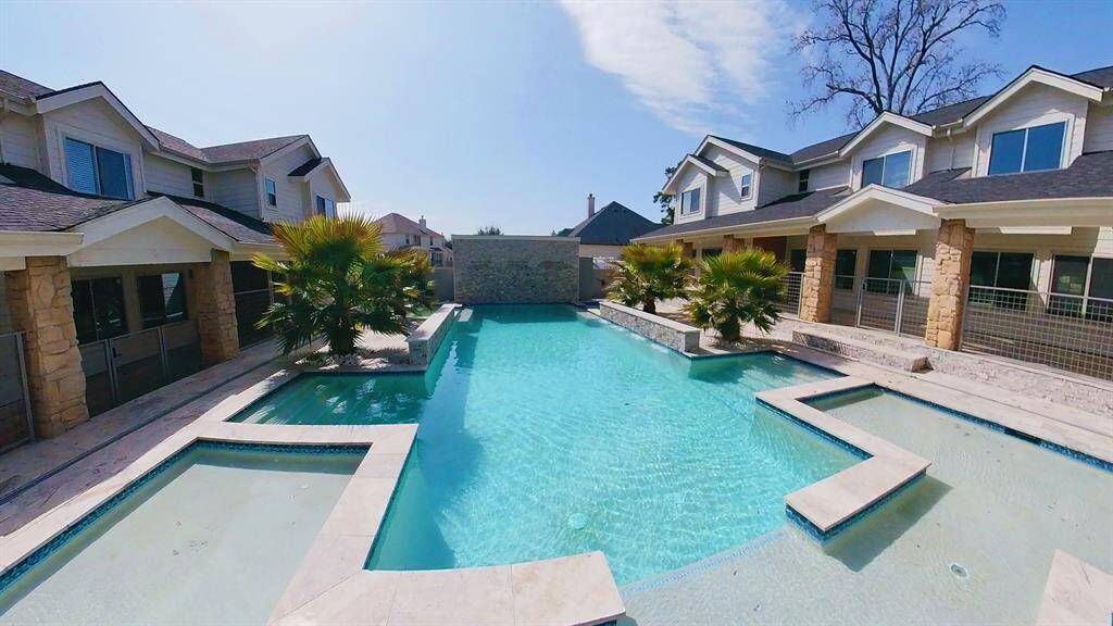 A resort-style pool in the center of this spectacular 8-home townhome community is a luxurious and inviting centerpiece for the neighborhood.