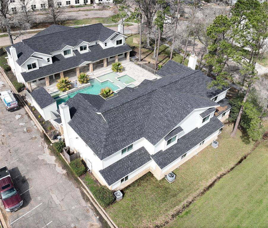 This aerial view captures the balance between the structured elegance of the townhomes and the natural beauty surrounding them.