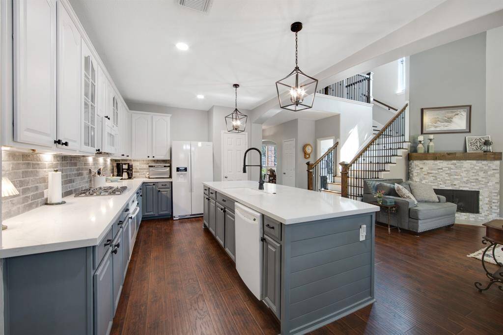 The kitchen offers ample storage with plenty of cabinet space, ensuring all your cooking essentials and pantry items are neatly organized and easily accessible.