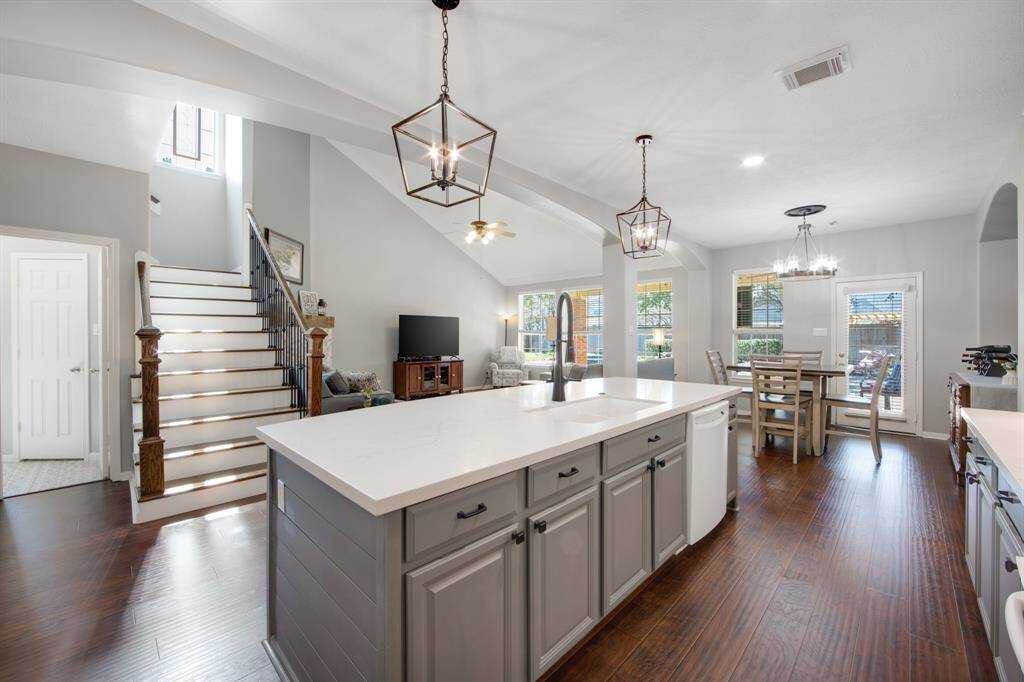 The kitchen seamlessly opens into the spacious family room, creating an ideal flow for entertaining and daily living. This open-concept layout ensures everyone stays connected, whether cooking, relaxing, or enjoying time together.