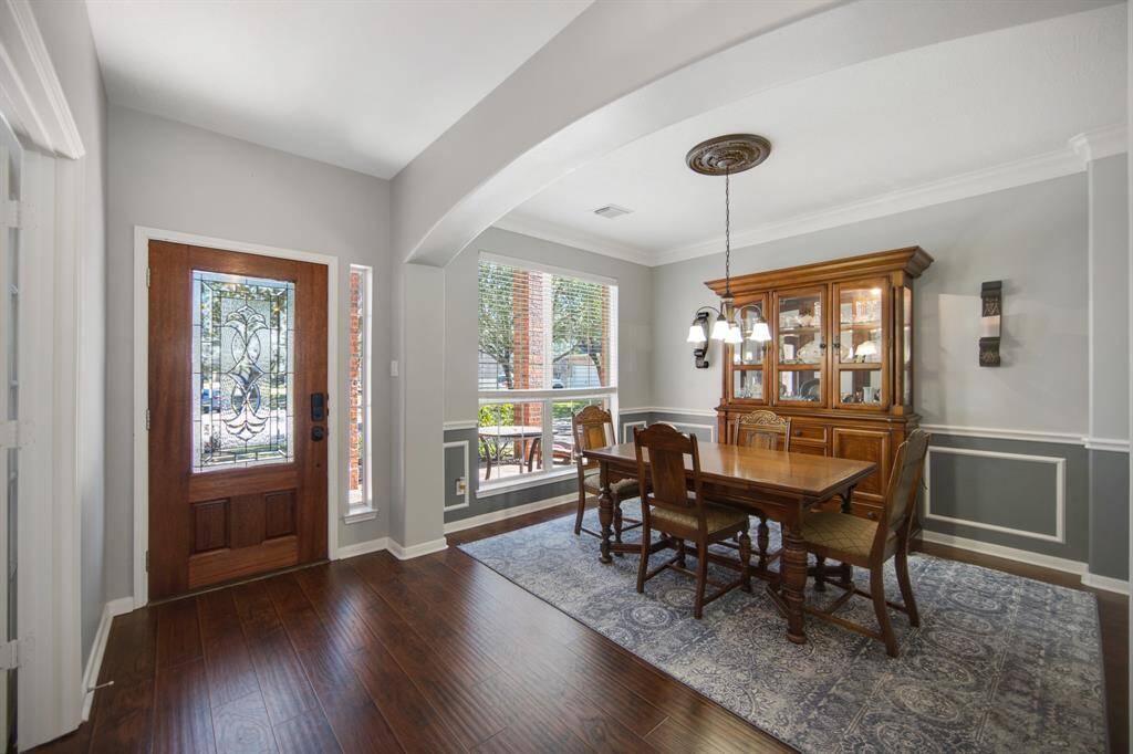 The downstairs of the home boasts stunning LVP flooring throughout all the main areas, adding warmth and a touch of luxury to the living spaces. Its rich tones seamlessly tie the rooms together, creating a cohesive and inviting atmosphere.