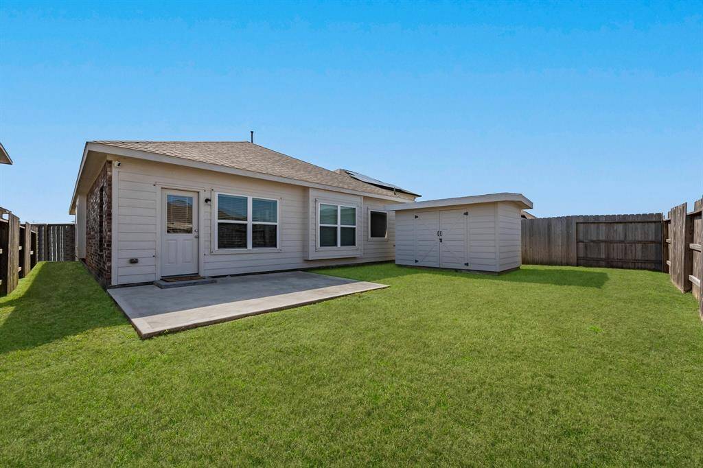 Back Yard with nice storage building