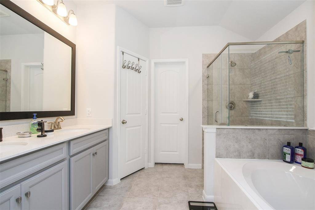 Primary Bathroom with separate shower and soaking tub