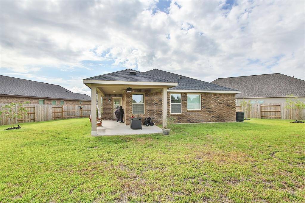 The covered patio is perfect for outdoor cooking and relief from the sun.