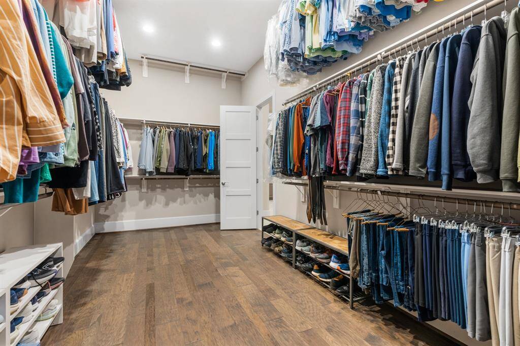 The primary bath opens into a HUGE his/her closet.