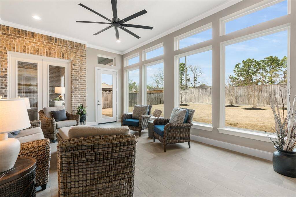 This outstanding feature has its own separate HVAC system, a sleek tile floor, and walls wrapped in windows, perfect for every season.