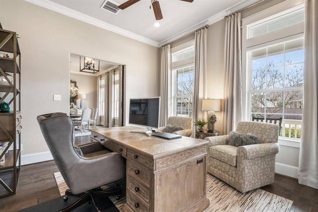 Transom windows provide plenty of natural light and take in views of the front landscape.
