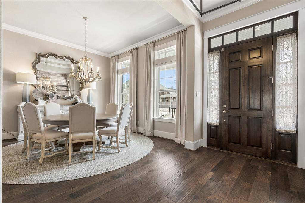 The first floor features 11-foot ceilings and an elegant neutral palette throughout.