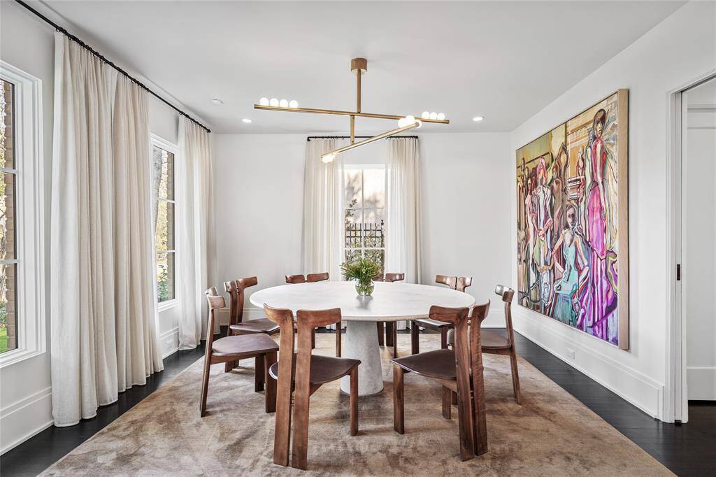 Dining room with custom drapes and access to the wet bar