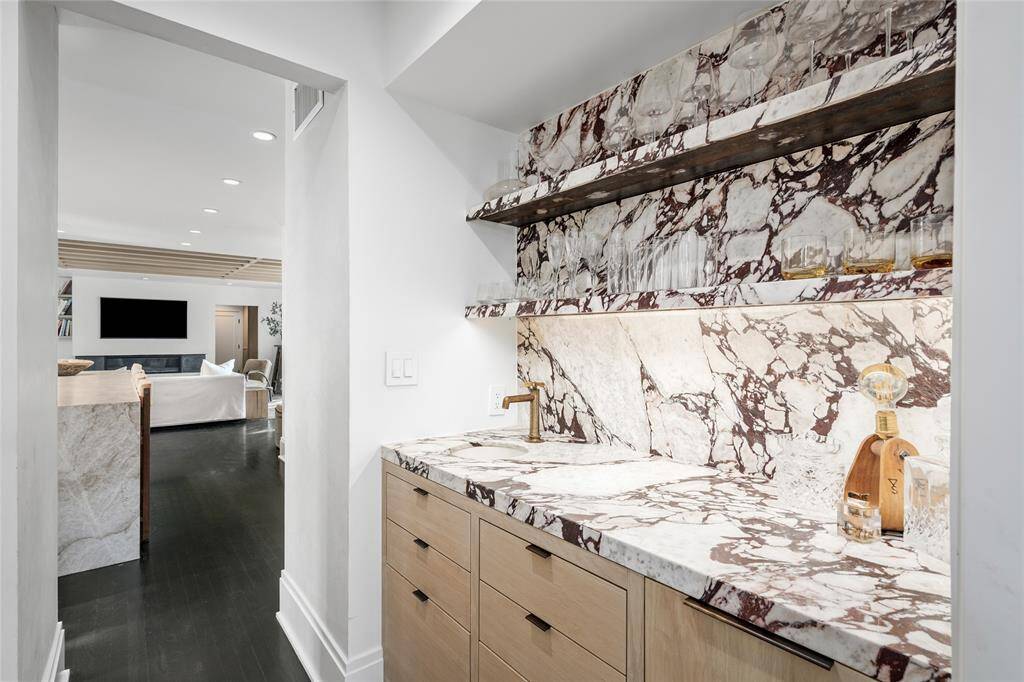 Wet bar complete with sink, ice maker and liquor drawers