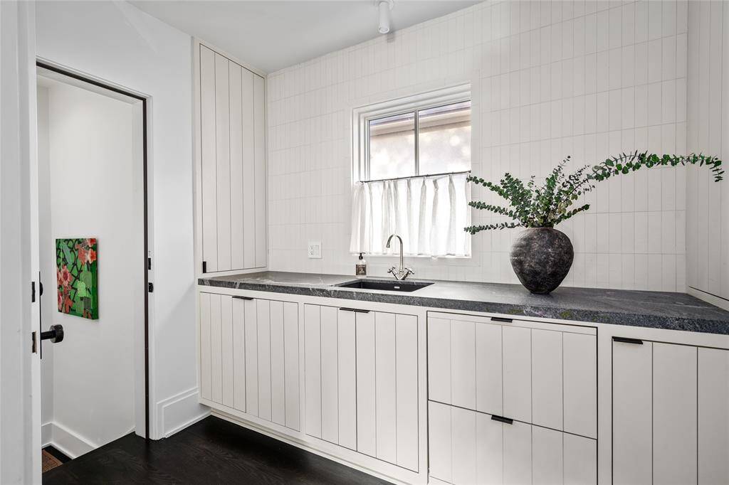 Playroom/Quarters sink area with ample storage and fridge drawers