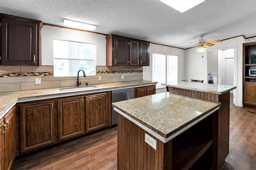 Huge kitchen with granite countertops and island with storage