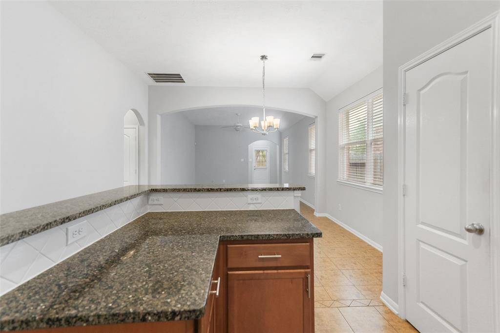 Extra counter space under the breakfast bar offers the perfect spot for a coffee station, prep area, or even a small bar!