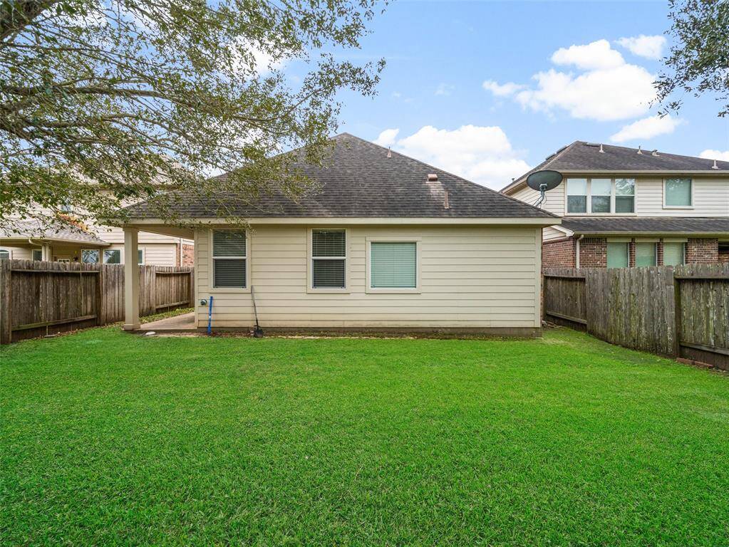 Enjoy the outdoor space with a covered patio; there's plenty of room to create your dream outdoor kitchen, add a gazebo, or even build a garden—endless possibilities to customize this backyard to your liking!