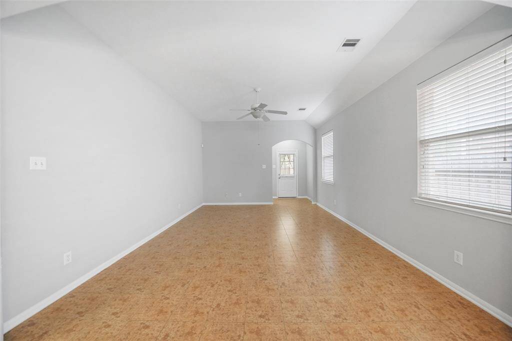 This open-concept living and dining space offers the perfect blend of style and function—ideal for hosting family dinners or cozy get-togethers.