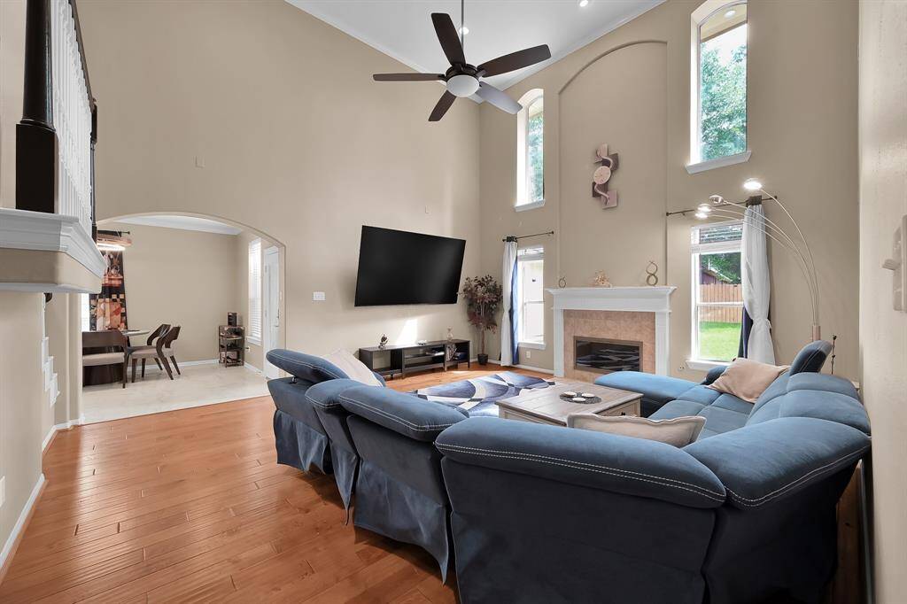 Nature is welcomed indoor with soaring ceilings and a wall of windows. These beautiful, manufactured hardwood floors are as durable as they are beautiful! The entire home has been freshly painted with a warm taupe color downstairs and light gray upstairs.