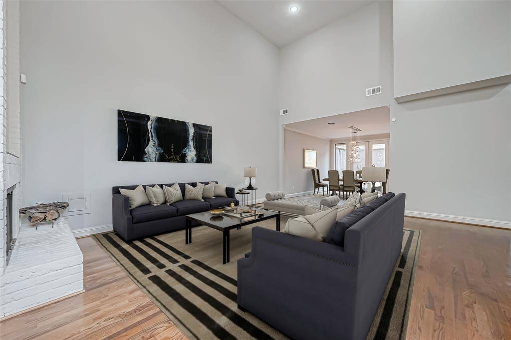 Check out this cozy living room! Not only is the room very spacious and comfy looking, but the high cathedral ceiling adds a whole new level of grandeur to it. With a room like this you'll really get a sense of how impressive the layout is. Virtually staged photo.