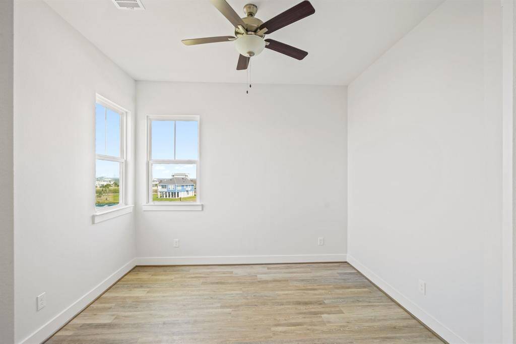 Guest Bedroom #3 with views of the lake, and Galveston Bay.