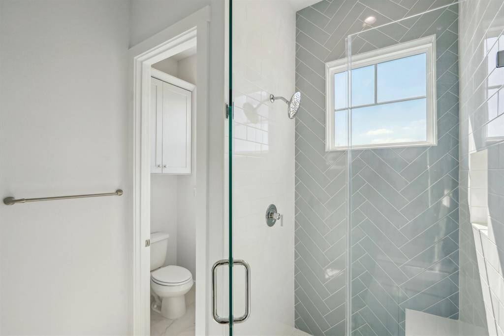 The custom tile work reflects the natural sunlight.