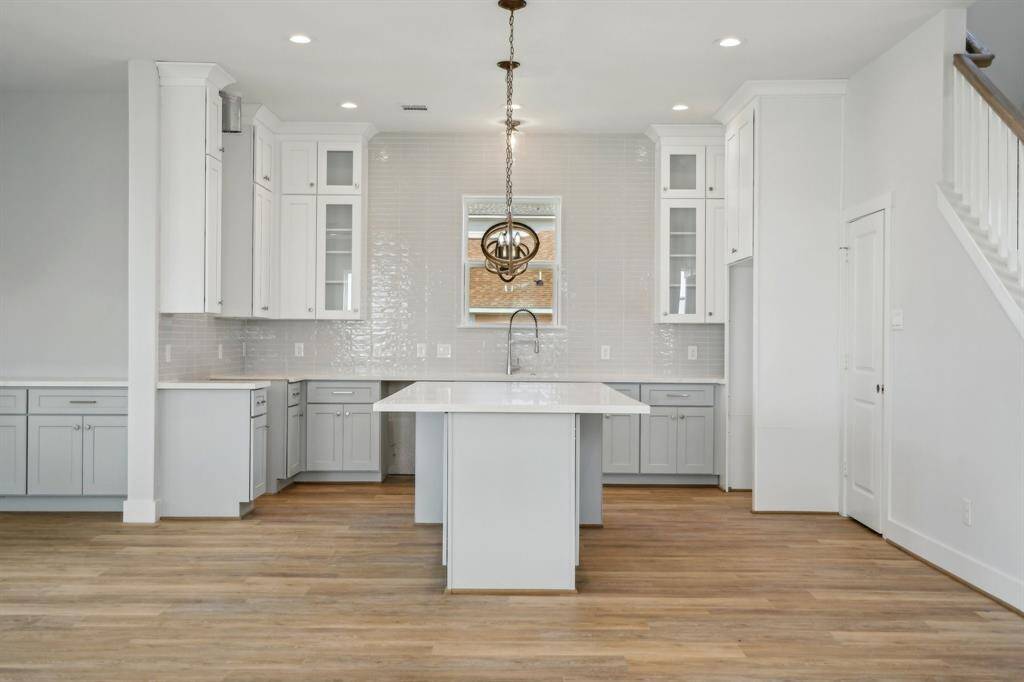 Beautifully designed kitchen anchored by this incredible island. There is storage located on both sides of the island.