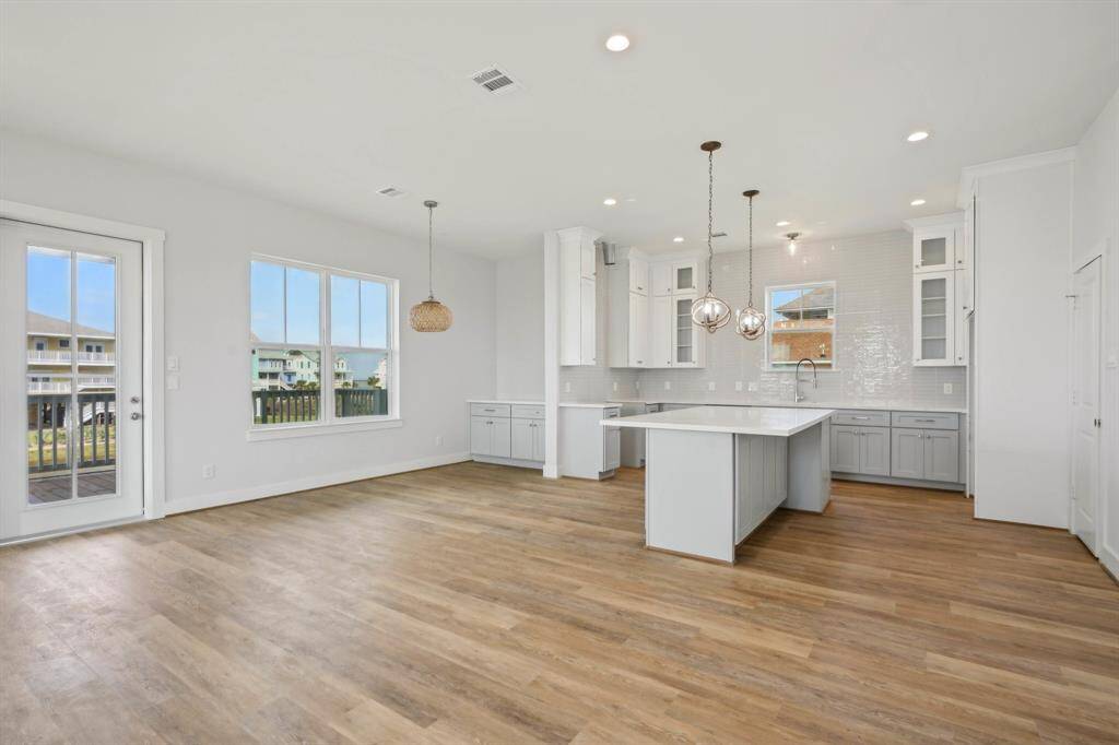 Looking from the entry way towards the kitchen and dining space.