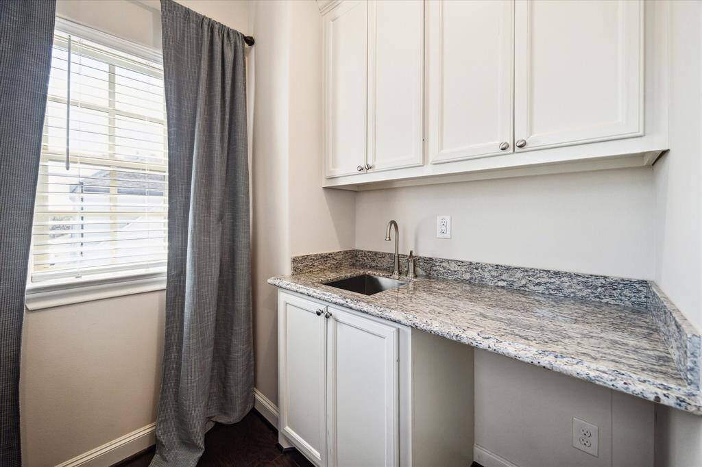 Keep refreshments within easy reach thanks to the top floor’s wet bar room, where you’ll find generous cabinet space, a granite counter, an undermount sink and room for a beverage center or wine refrigerator.
