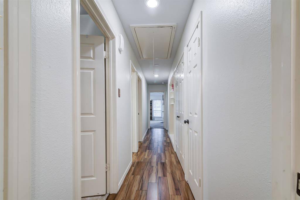 Bright hallway leading to various rooms.