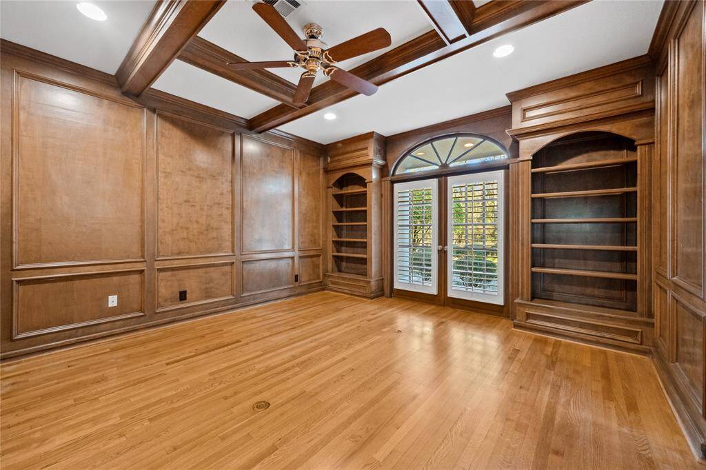 Large window in Study... arched window... Gorgeous wood...