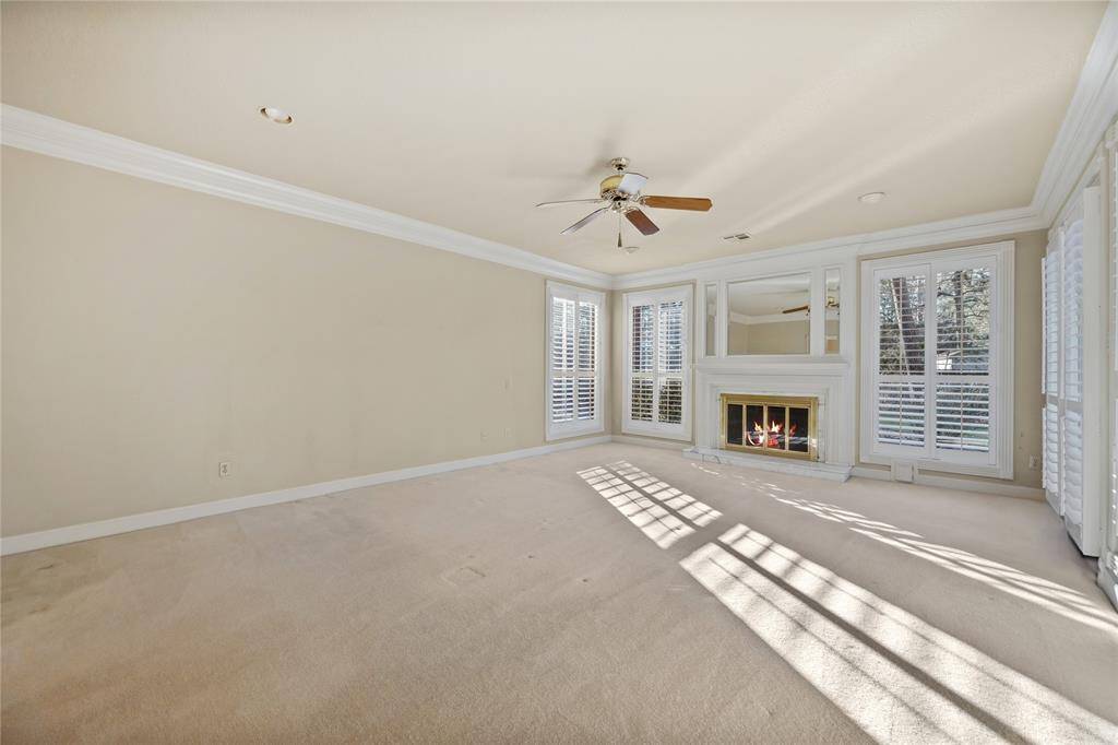 Yes... you are looking at the Primary Bedroom downstairs... with Plantation shutters, Gas log fireplace, and door the the right enters onto the wood deck...
