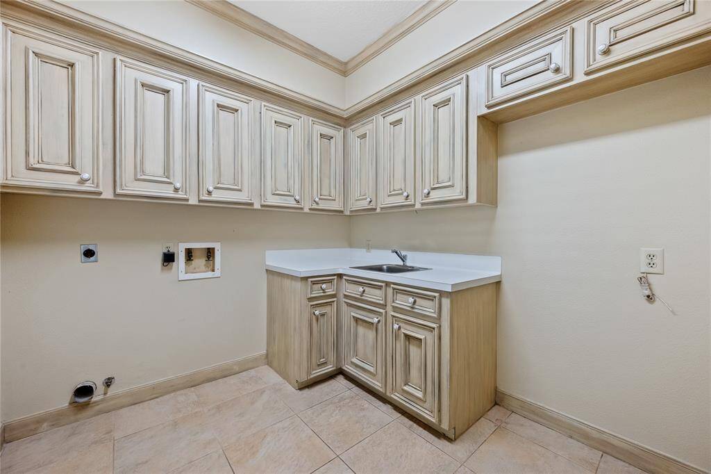 Utility room off the kitchen downstairs, and just off the entry from the 3 car attached garage...