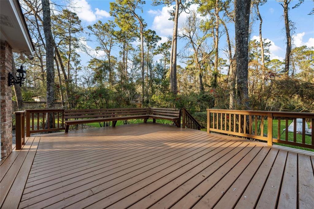 Lovely wood deck on the back... Note the covered WELL for your Sprinkler System!