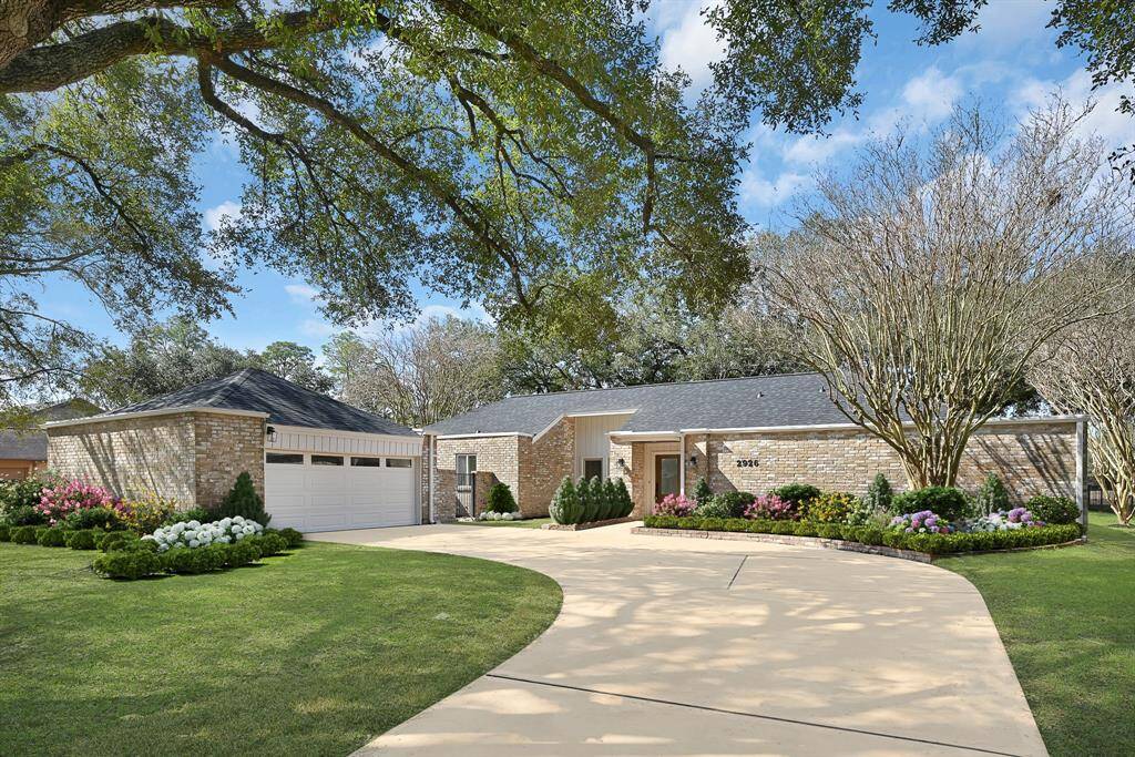 With just a little imagination and creativity, you could transform this spacious front yard into the most stunning landscape and curb appeal in the neighborhood — just like this virtually staged front yard, perfectly complementing the fully renovated home in a serene golf course community.