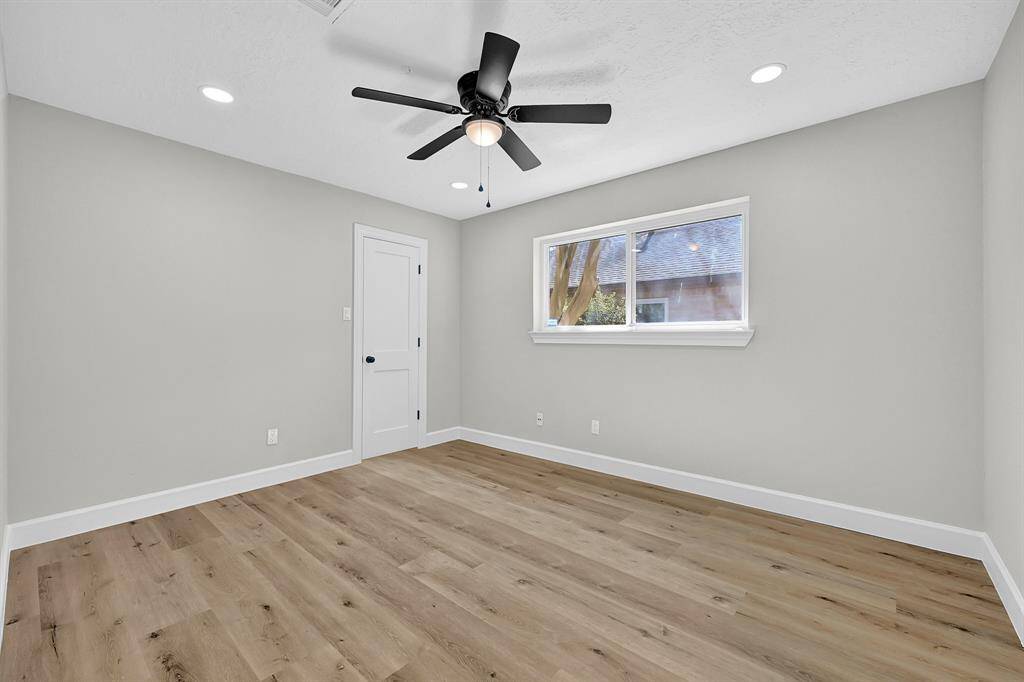 This bedroom is designed to provide a practical and inviting space where residents can relax and unwind, showcasing a blend of durability, comfort, and aesthetic appeal.