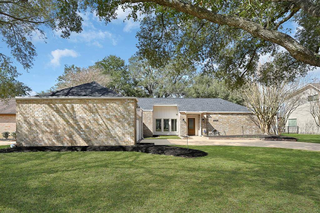 Nestled in an established golf course community, this charming one-story home features four bedrooms and two and a half bathrooms. Its classic brick façade adds timeless character to the well-maintained exterior, complemented by a detached two-car garage conveniently located beside the home.