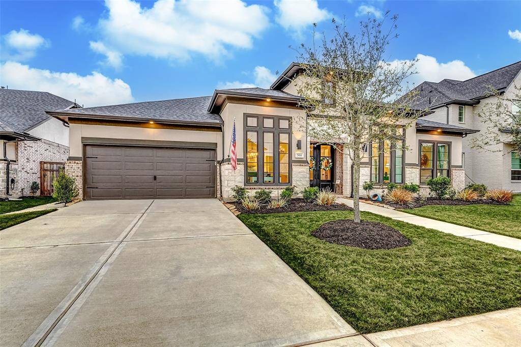 Provides ample parking and storage, ideal for multiple vehicles or a home workshop. Upgraded to include a cabinetry package, shelving, bike racks and more!