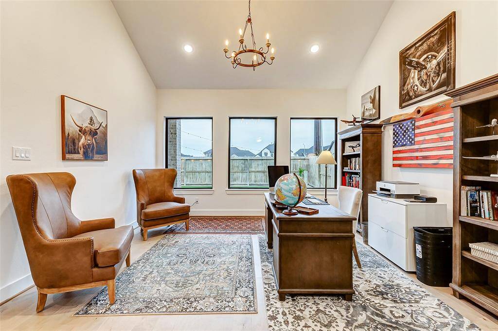 Breathtaking Vaulted Cathedral Ceilings – The soaring ceilings enhance the home's grandeur, complemented by a stunning custom chandelier that adds elegance and sophistication.