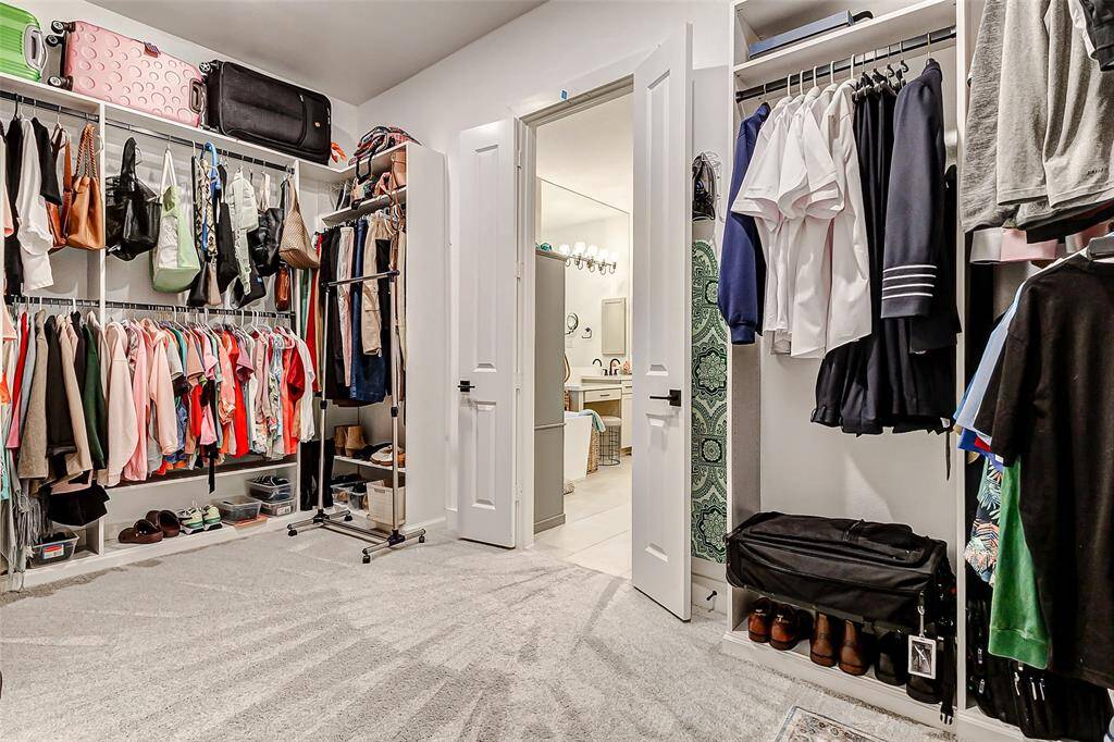 Direct Laundry Access – The primary suite has convenient access to the laundry room for added efficiency.