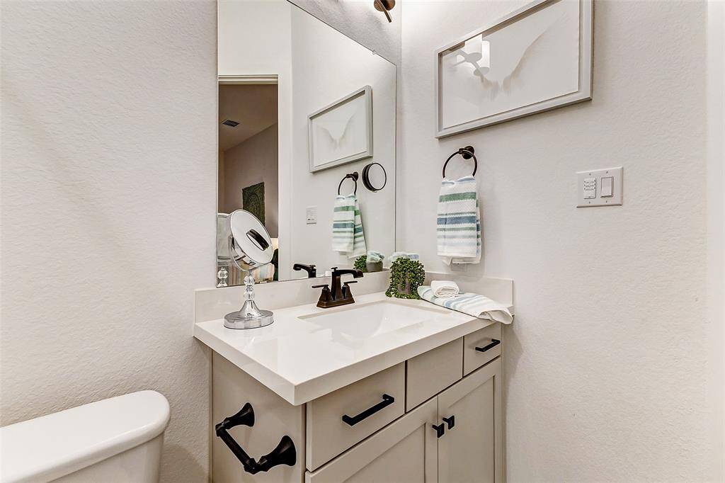 Each secondary bath is equipped with a tub and shower with elegant tile surround, modern dove gray vanities and so much more.