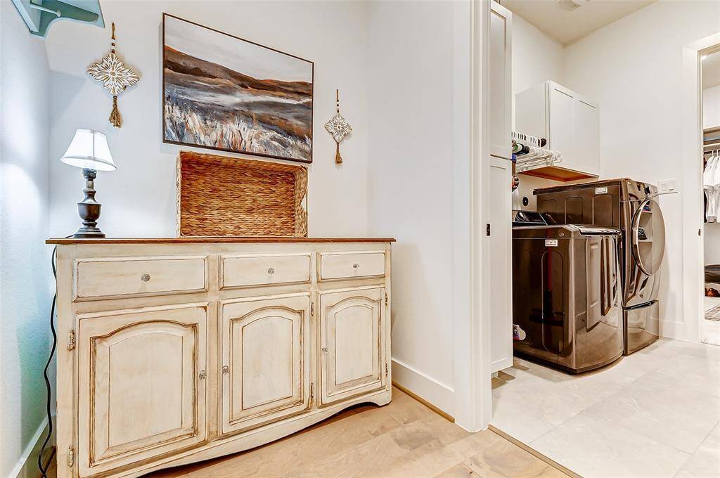 Upgraded Laundry Room – Features custom cabinetry and extra storage space.Smart Storage Solutions – Multiple linen closets and built-in shelving maximize organization.