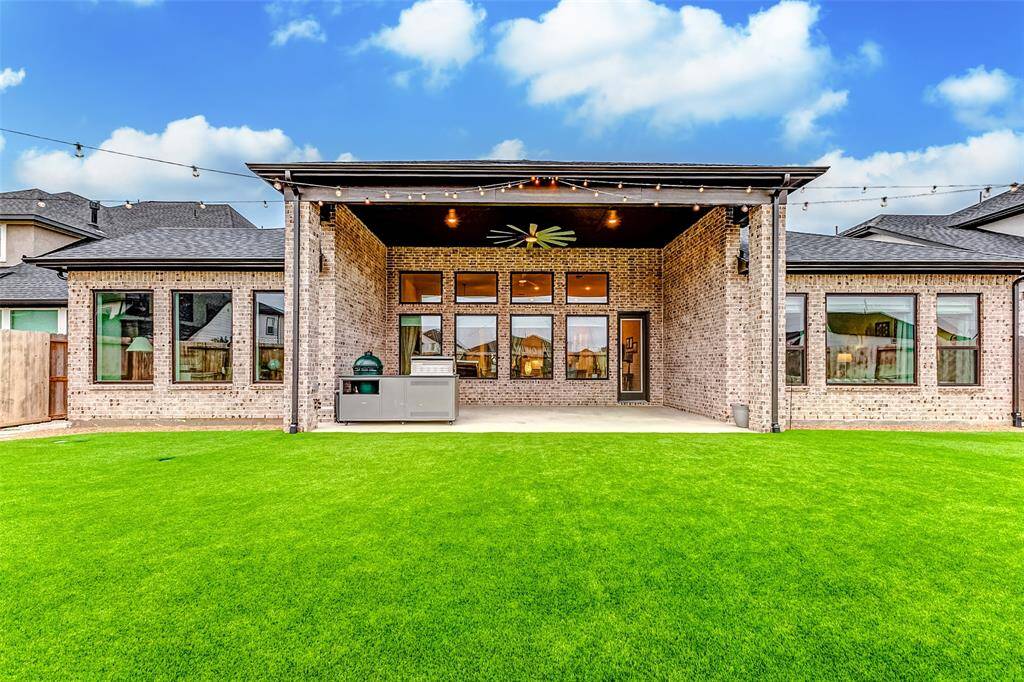 $15,000 Backyard Transformation – Premium pet turf, stone pavers, and a French drain system ensure beauty and low maintenance.