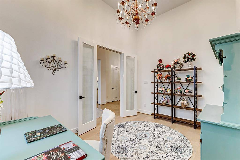 The private study features beautiful French doors, offering a quiet and stylish space for work or reading.