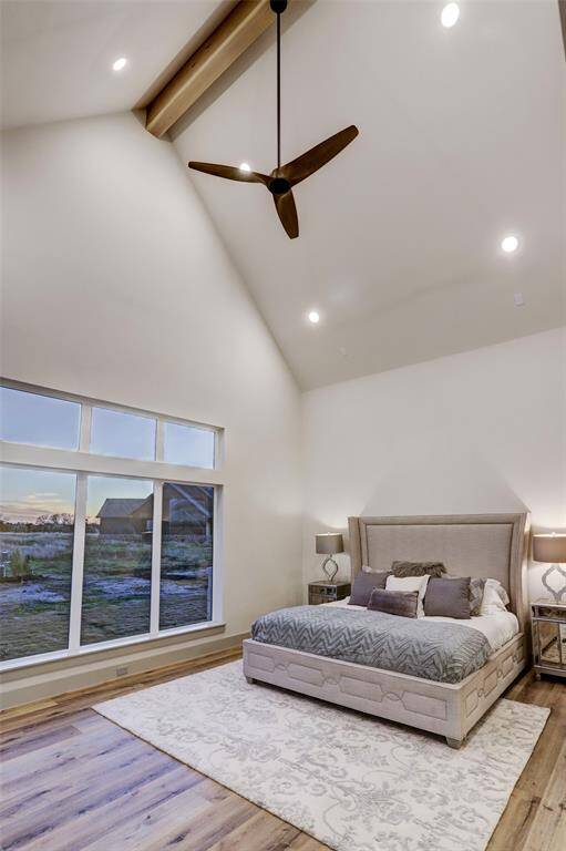 Primary bedroom with vaulted ceilings