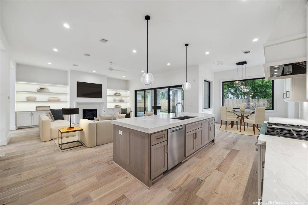 Virtually staged family and breakfast room. Quartz island / countertops and top-of-the-line Miele appliances.
