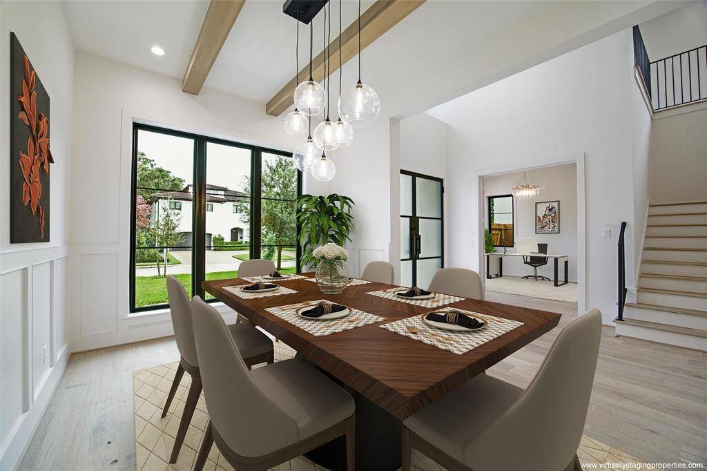 Virtually staged dining room with view toward foyer and study.